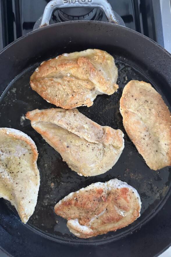 chicken breasts cooked in a skillet