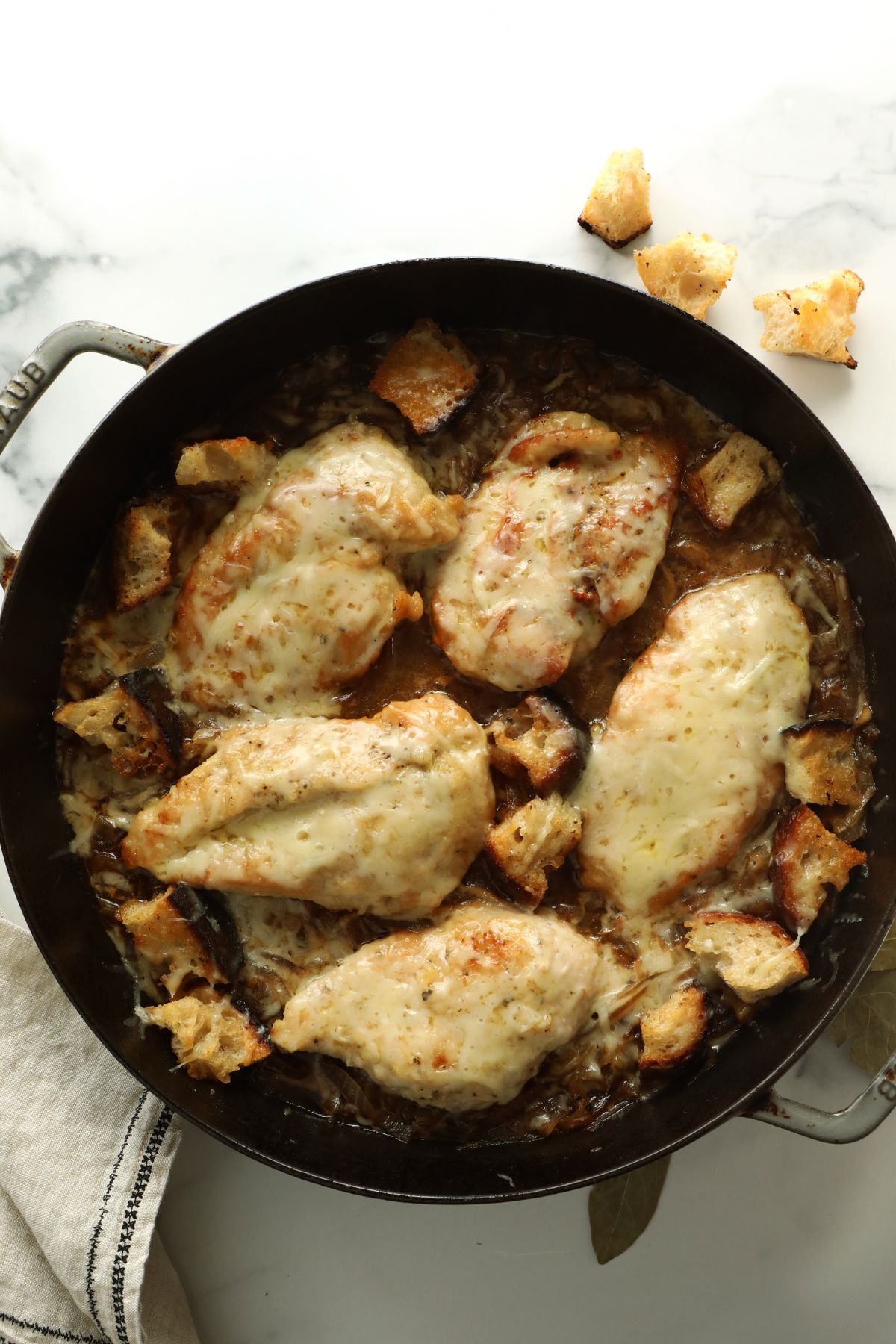 french onion chicken soup in a cast iron skillet