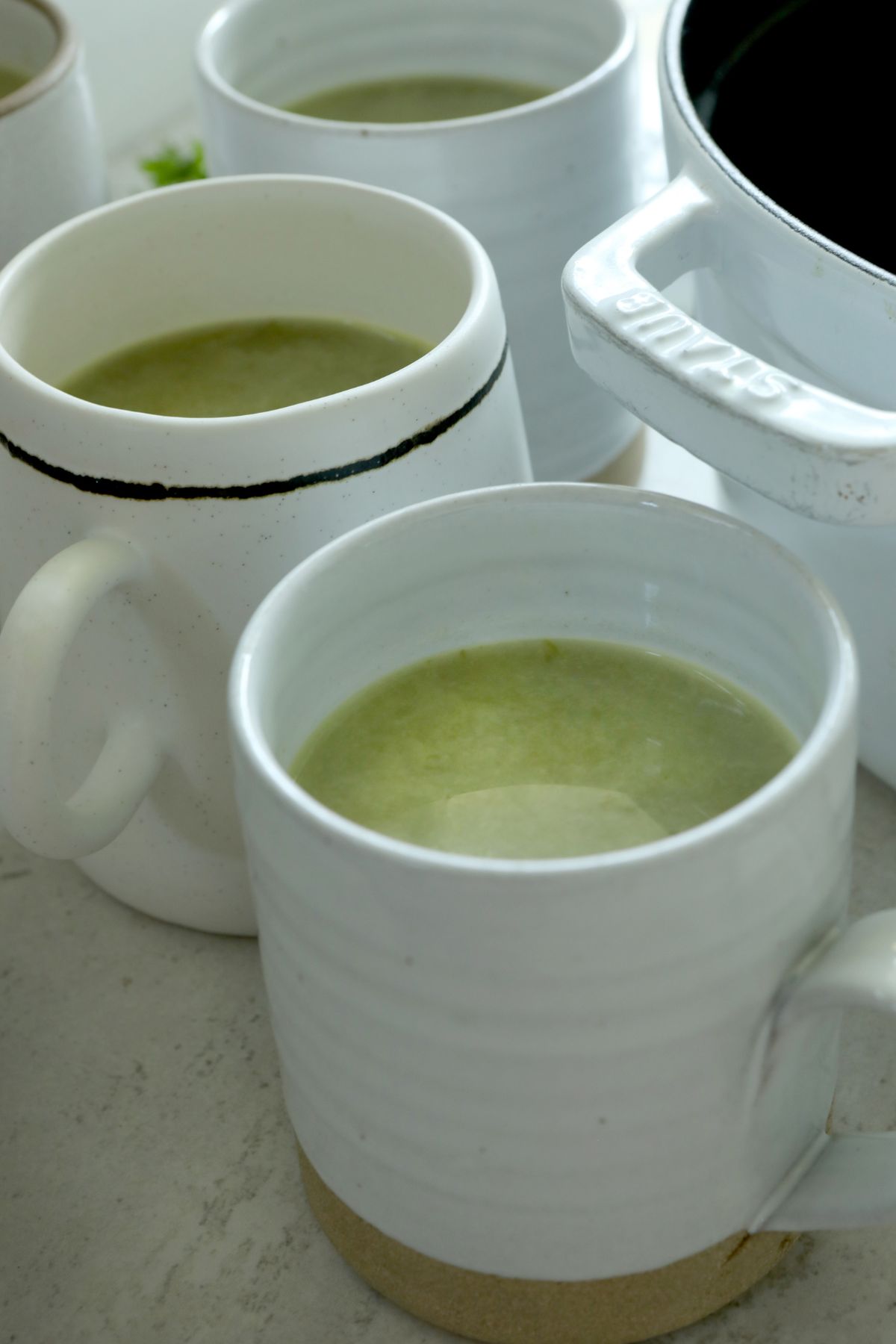 a close up of a mug filled with soup