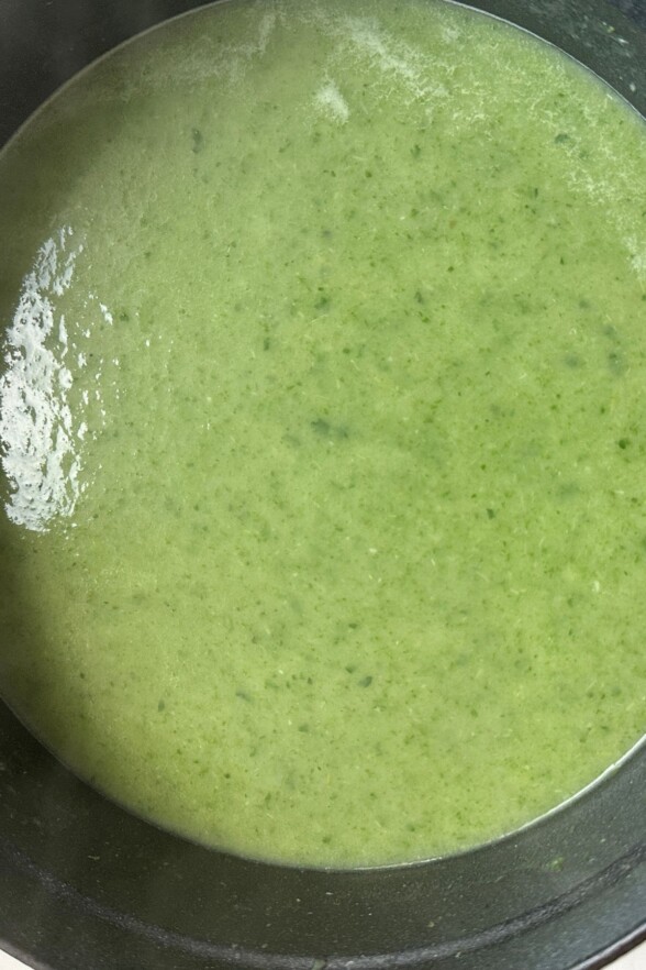 using an immersion blender to make blend the soup into a creamy consistency