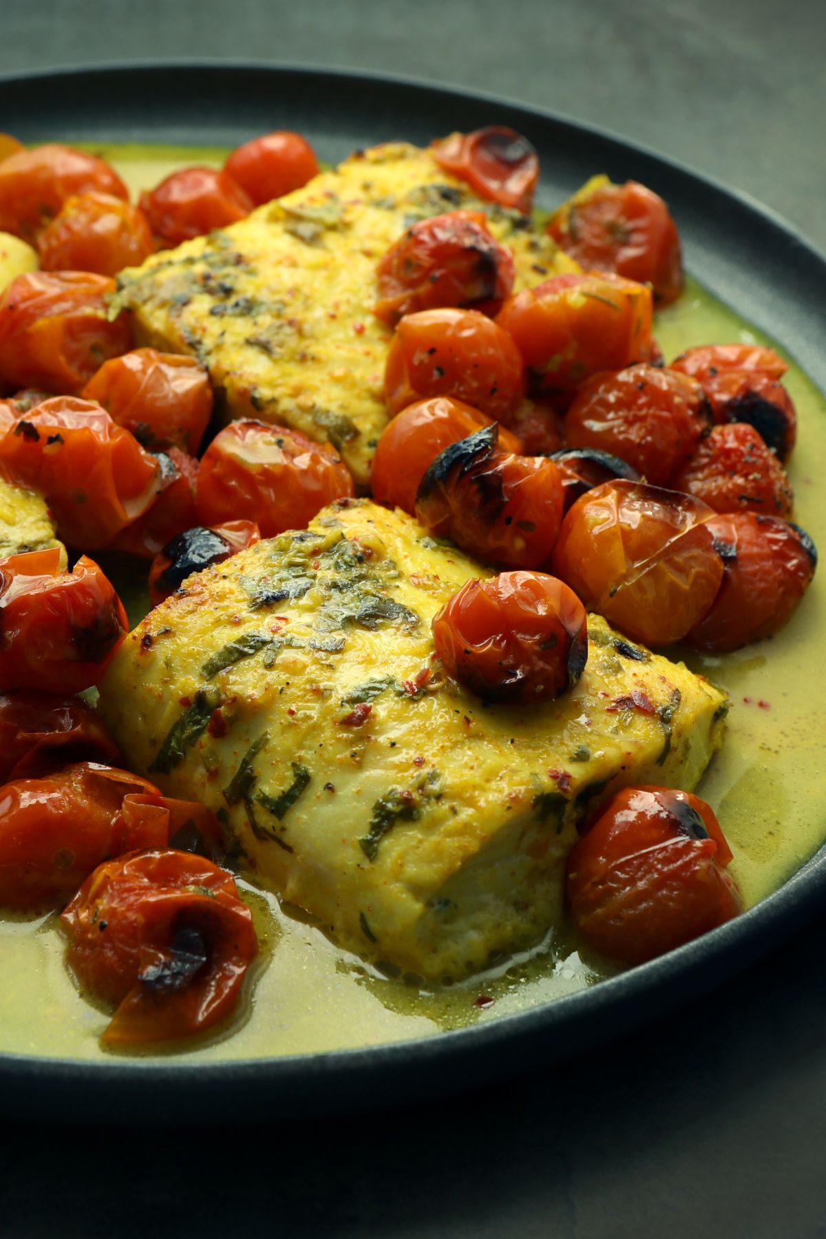 coconut fish and tomato bake in a pan 