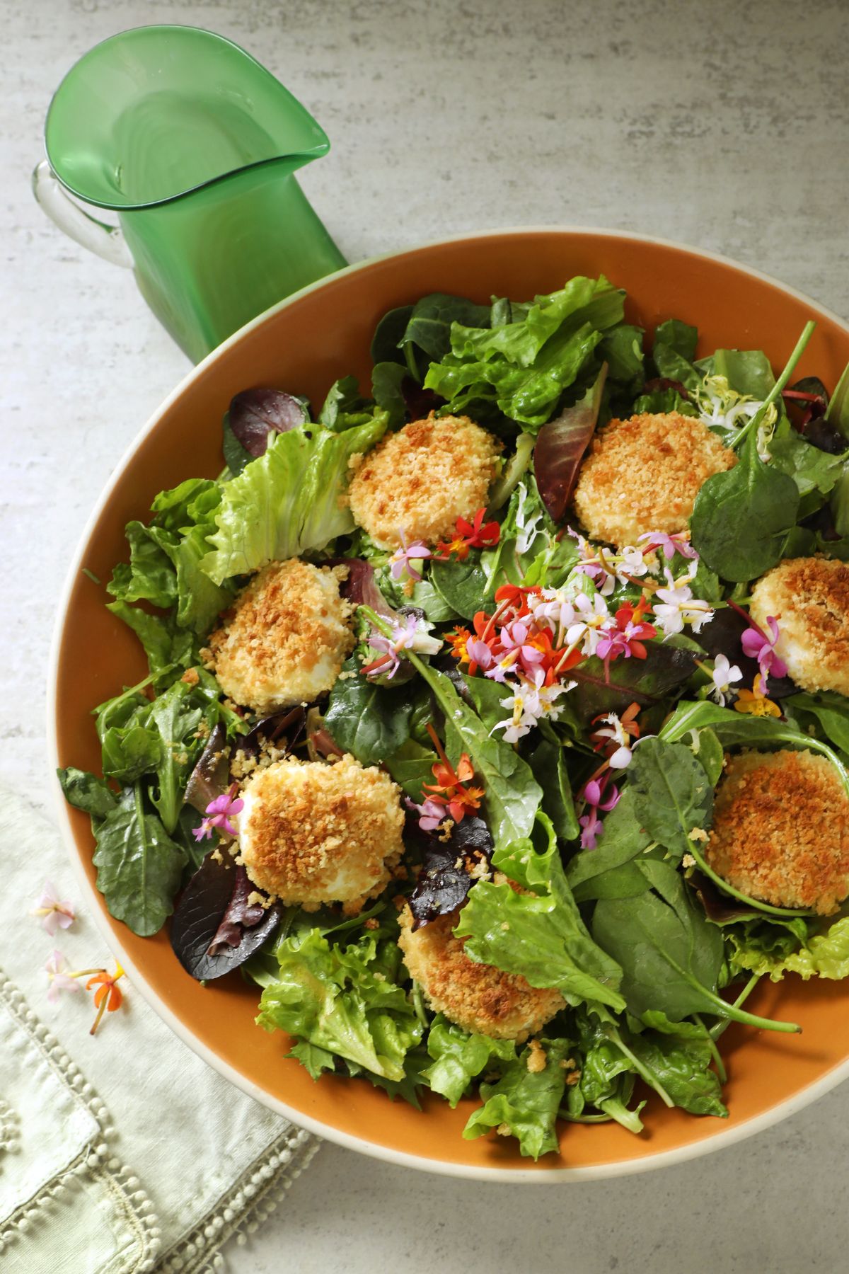 salad greens with cheese in a bowl