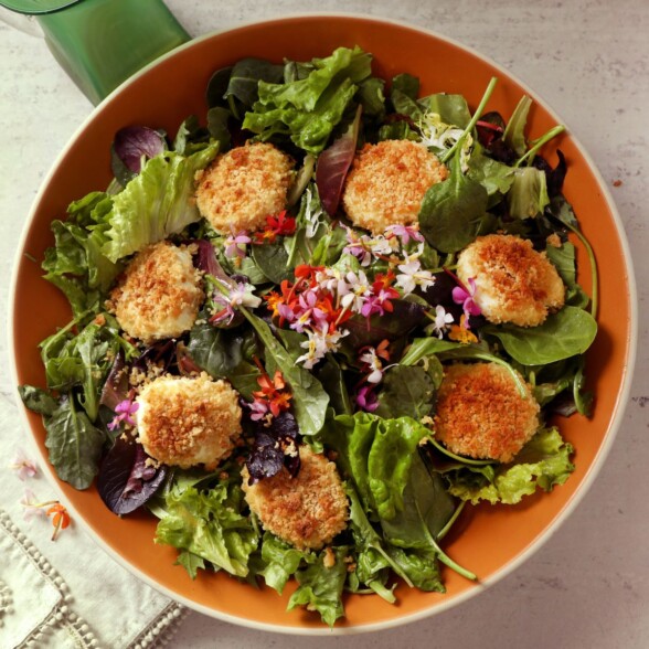 warm baked goat cheese salad in a bowl