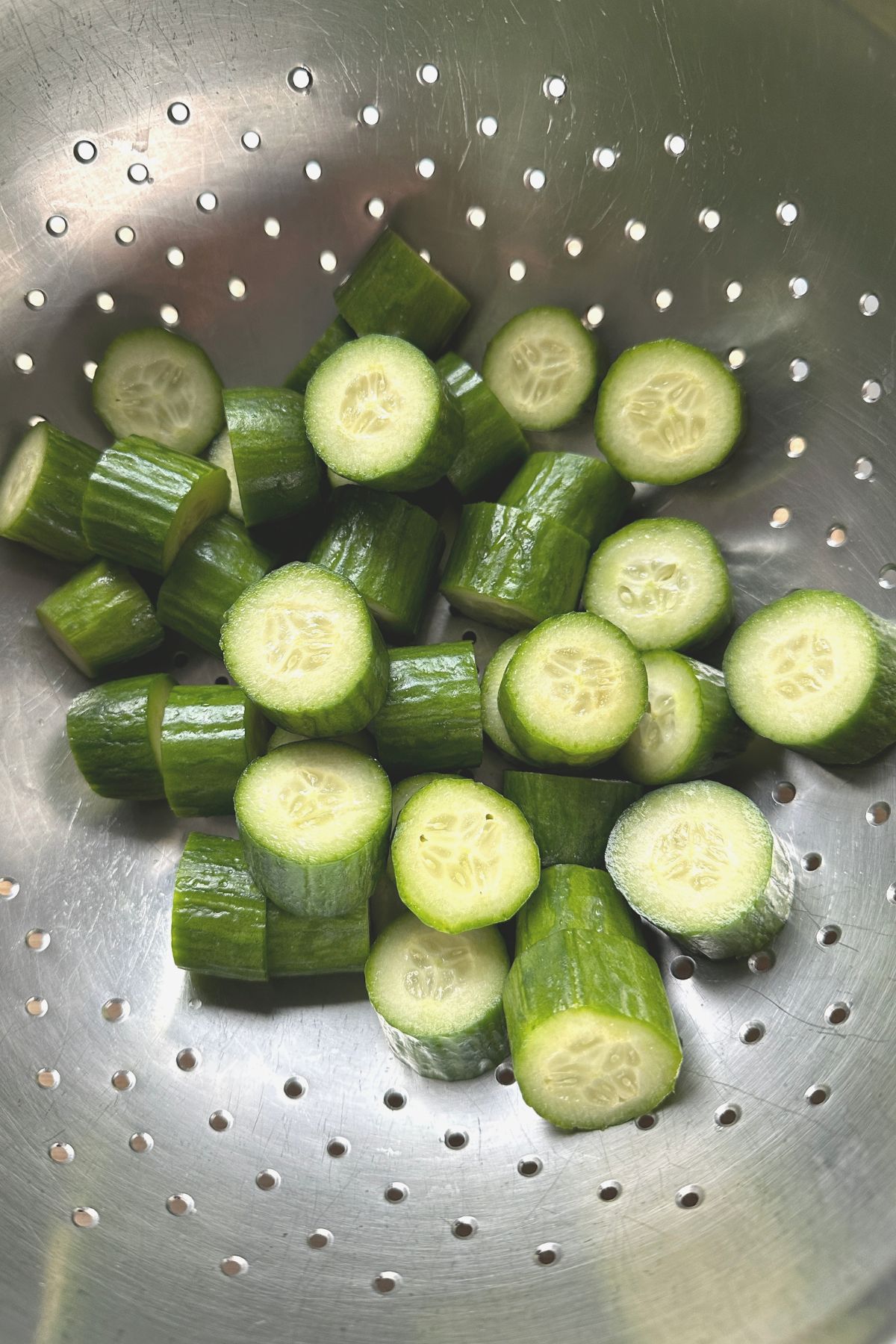 Cucumber slices in a colander