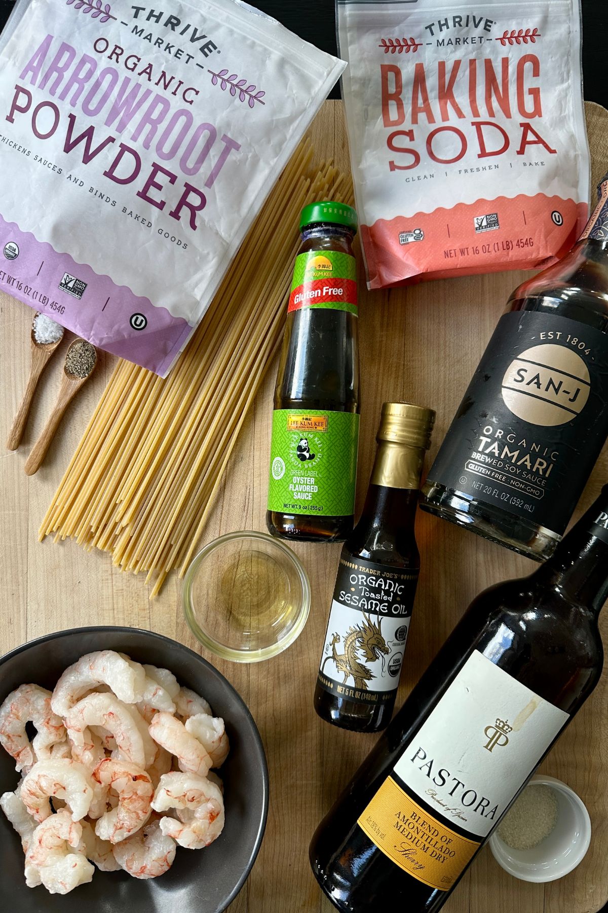 noodles and sauce ingredients atop a cutting board