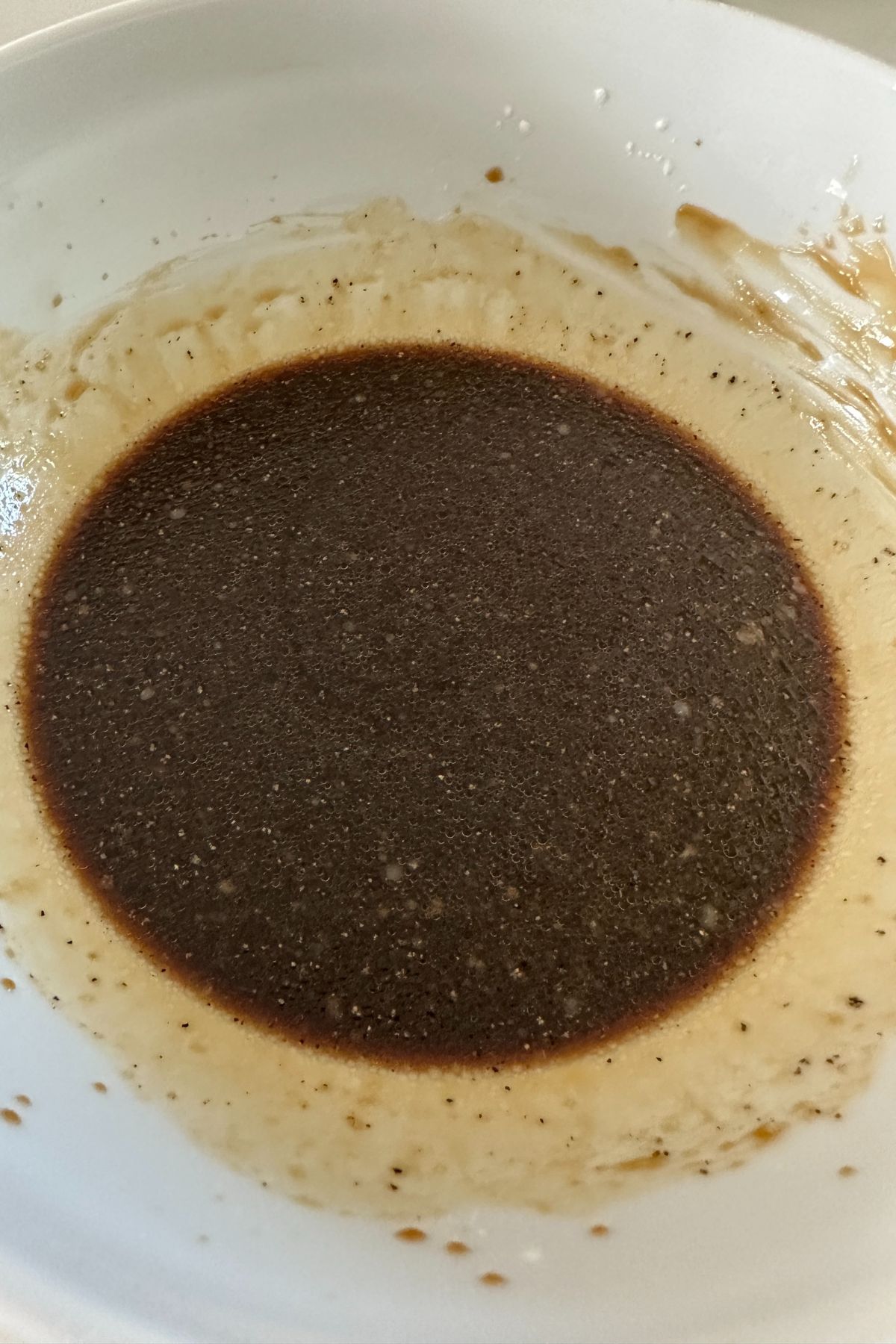 sauce ingredients mixed in a white bowl 