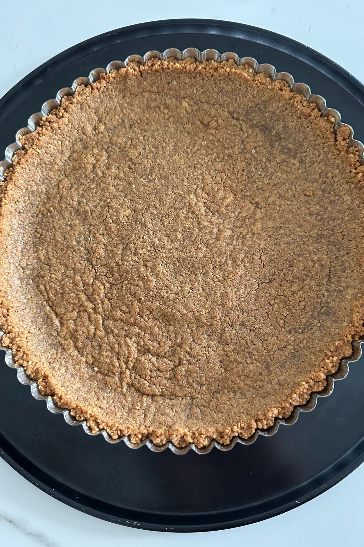 baked graham cracker crust cooling and ready for the filling