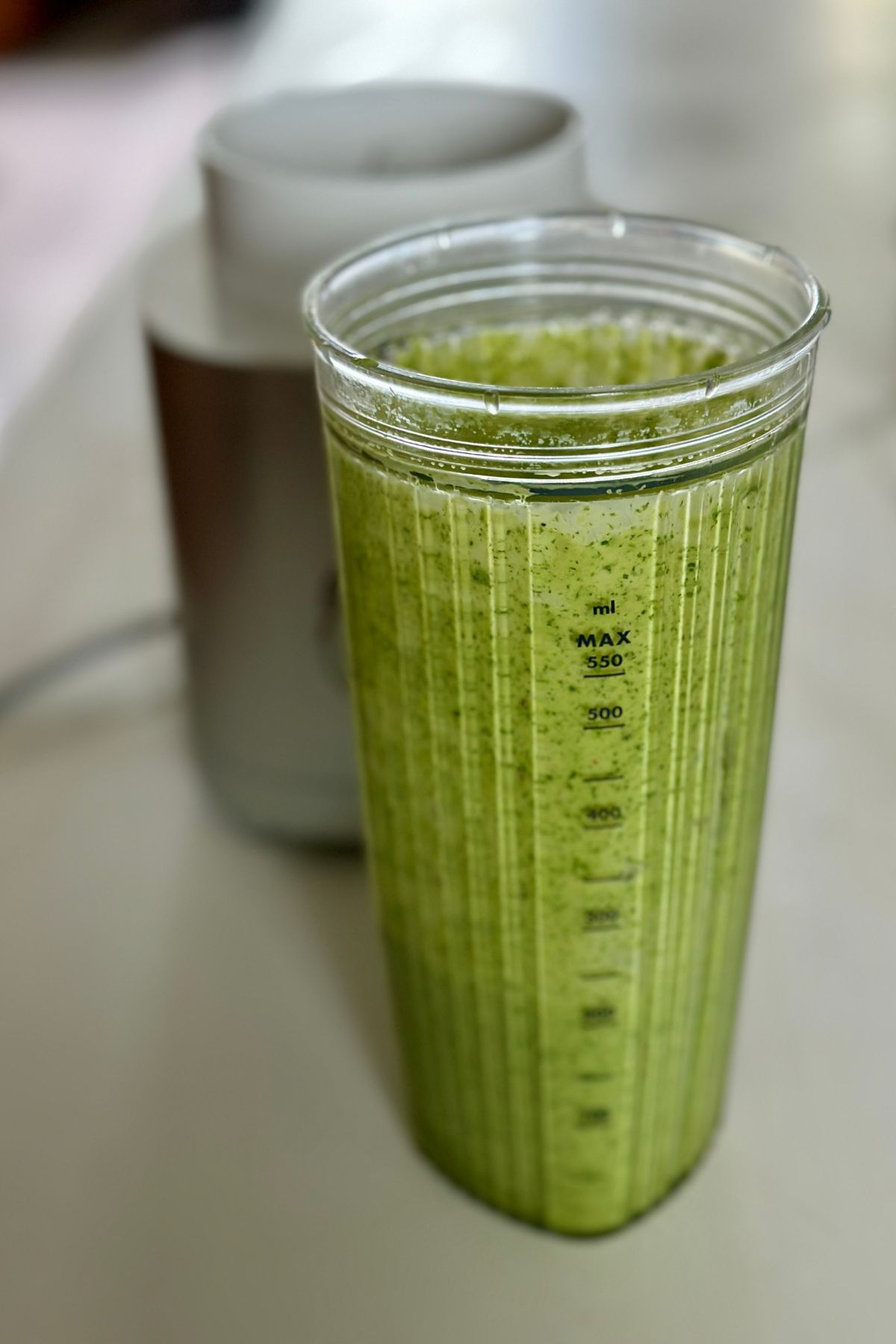 finished basil mint dressing in a small blender ready to be tossed into the summer orzo salad