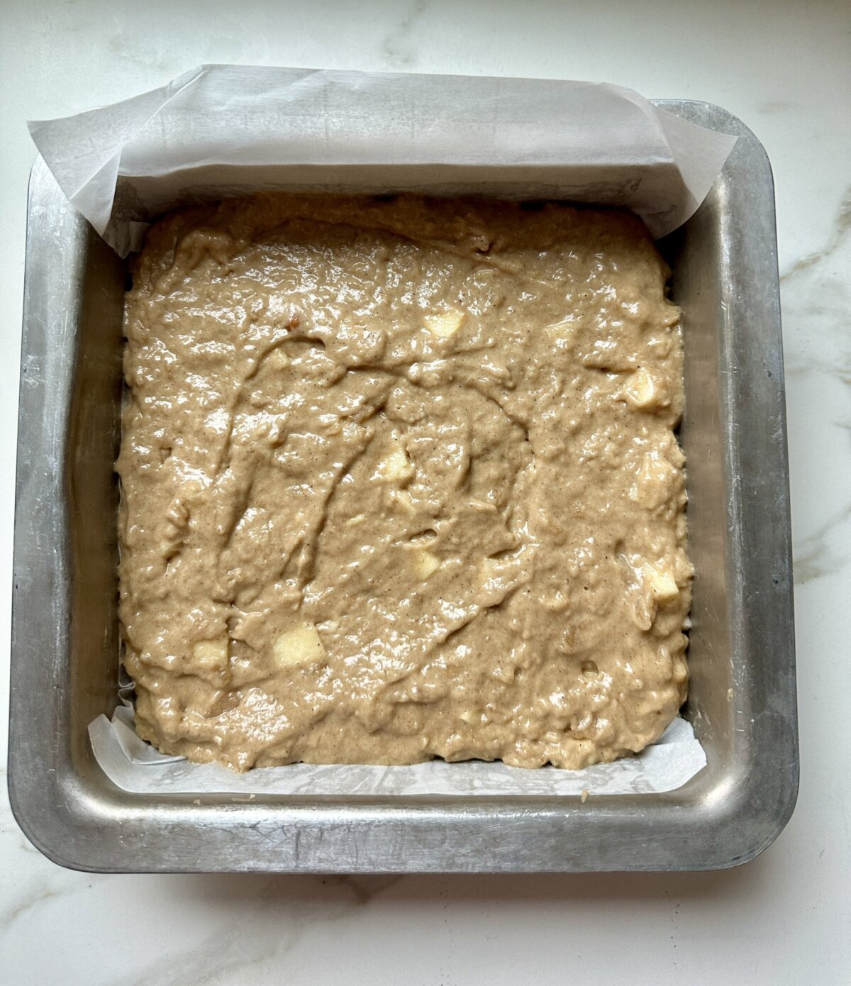 a pan with coffee cake batter in a pan