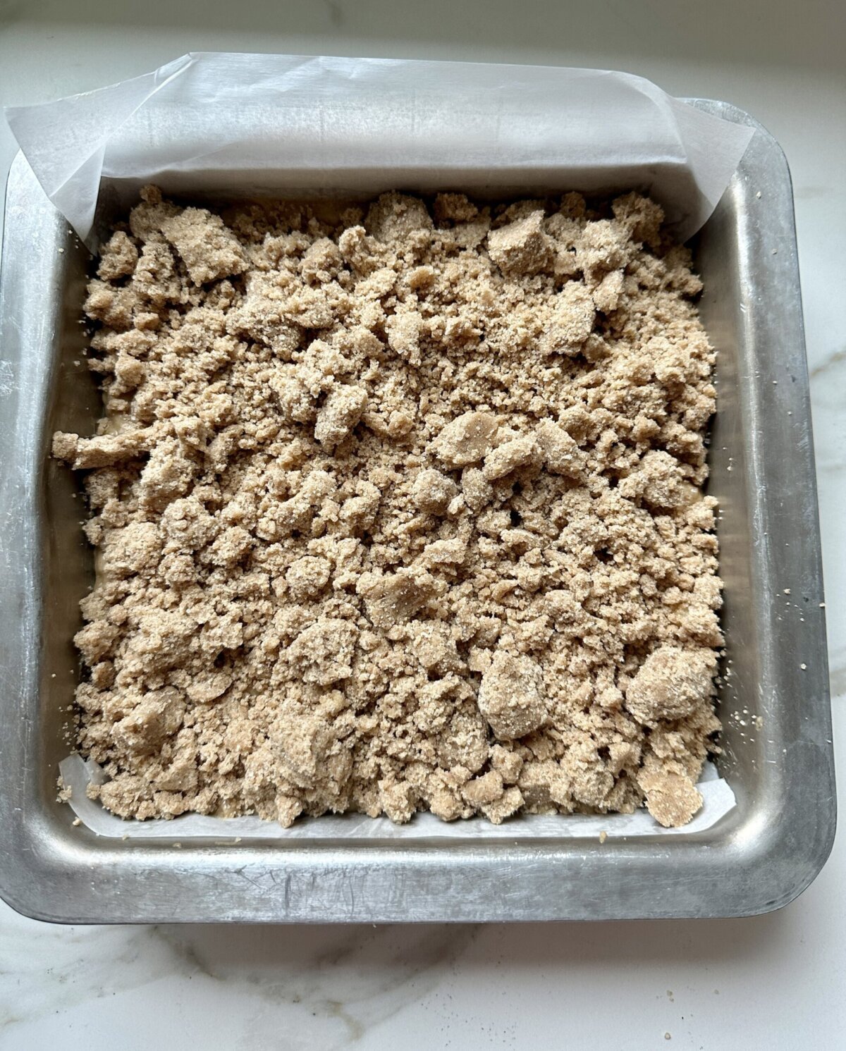 a crumble topping on top of coffee cake