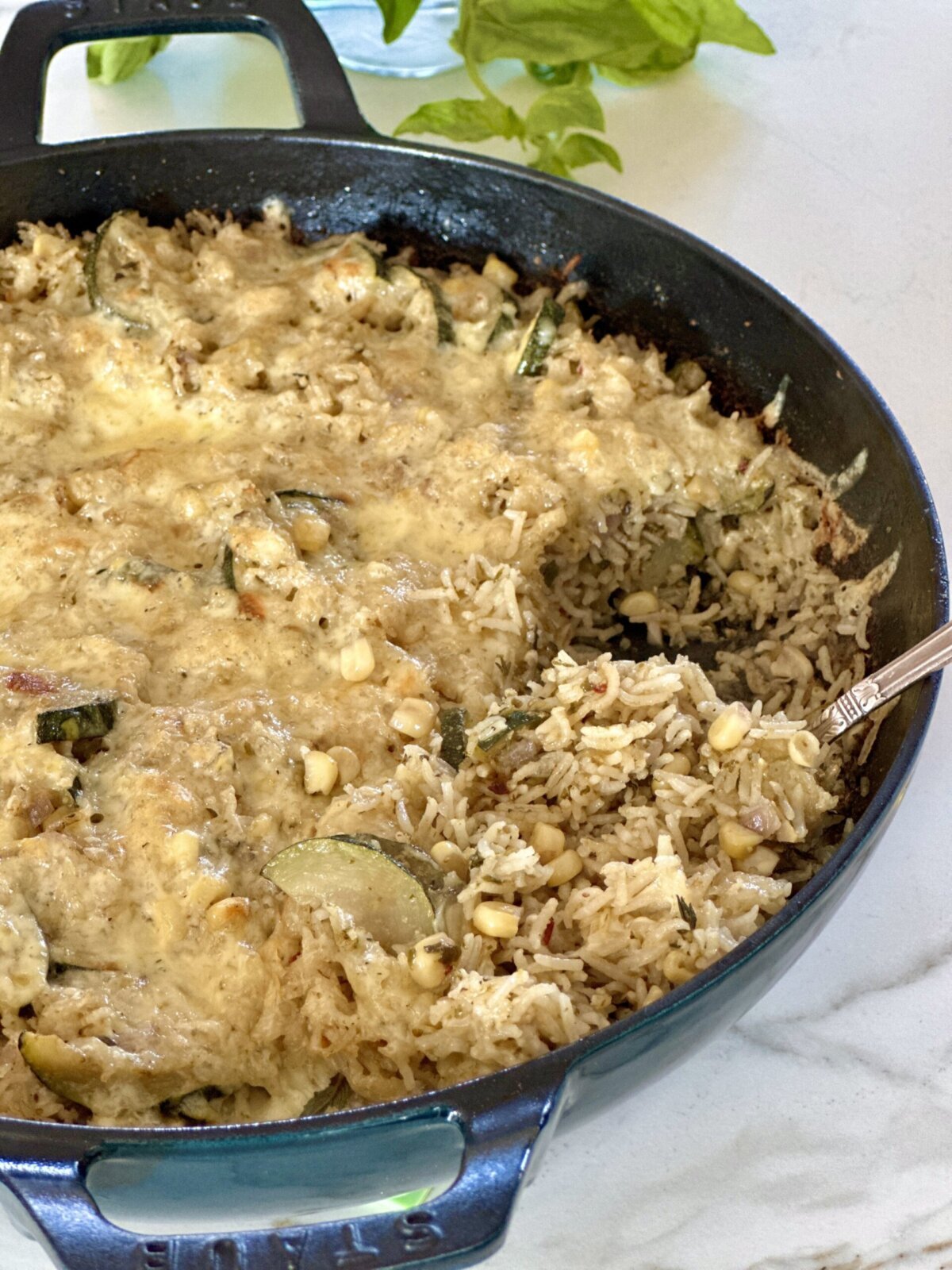 scooping a serving of this zucchini rice bake recipe