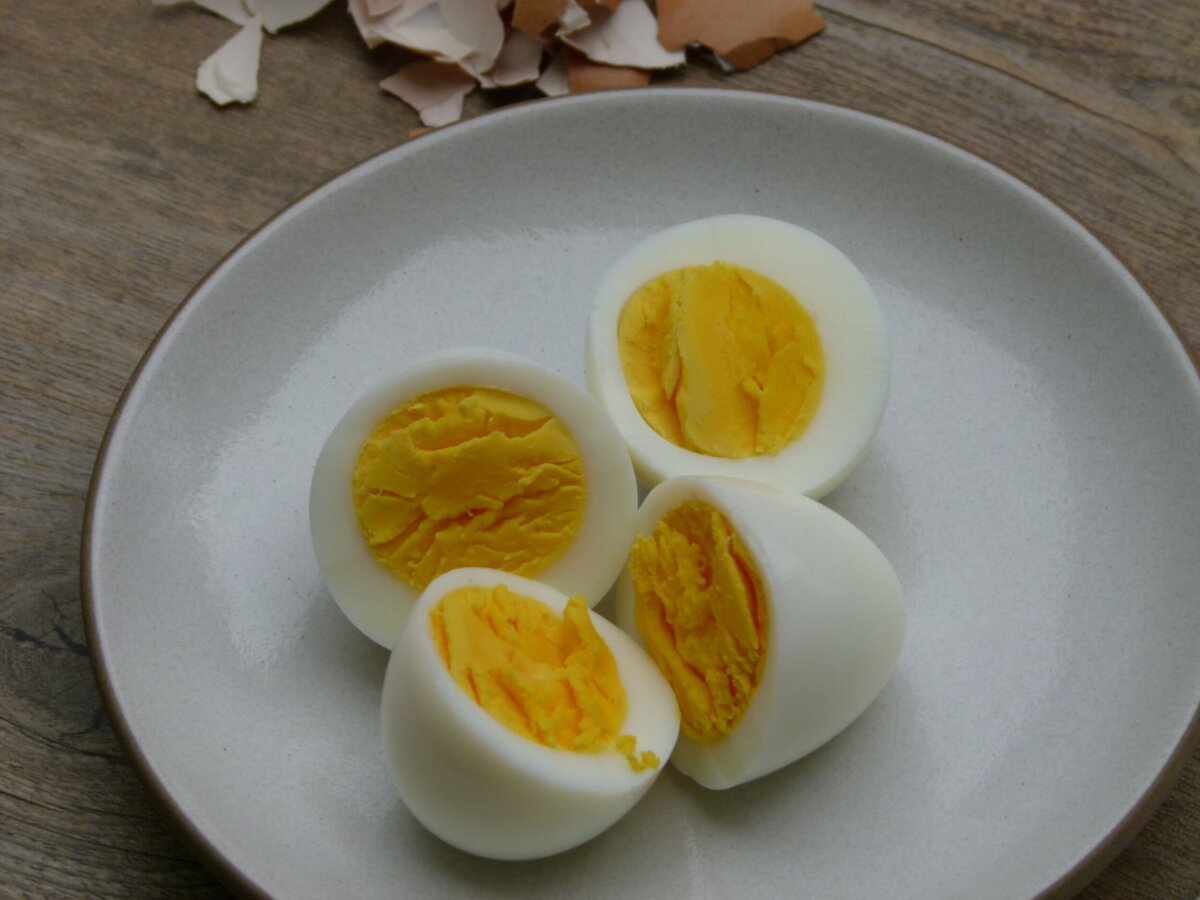 cooked eggs peeled and cut to show the yolks