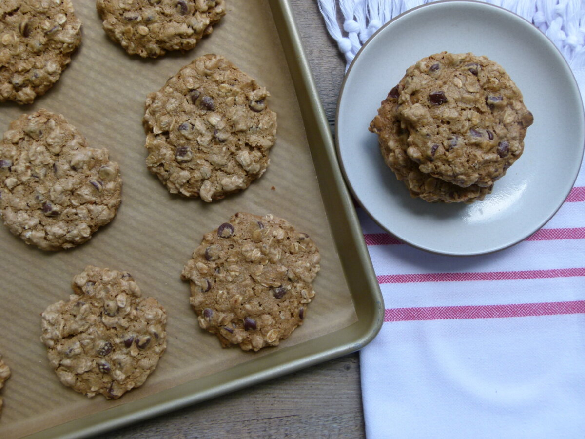 vegan oatmeal chocolate chip cookies on a baking sheet